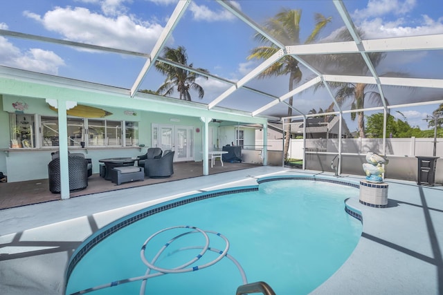 356 SW Grimaldo Ter, Port Saint Lucie, FL 34984 - view of pool featuring french doors, a patio, and a lanai