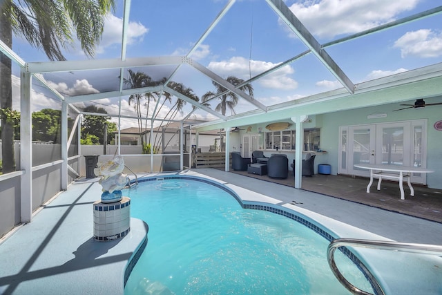 356 SW Grimaldo Ter, Port Saint Lucie, FL 34984 - view of swimming pool featuring a ceiling fan, a patio area, french doors, and a lanai