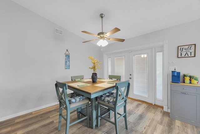 356 SW Grimaldo Ter, Port Saint Lucie, FL 34984 - dining room featuring french doors, light wood-style floors, ceiling fan, and vaulted ceiling