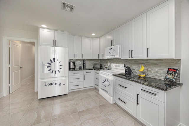 1518 Lee Ct, Lake Worth, FL 33461 - kitchen featuring white appliances, backsplash, white cabinets, dark stone counters, and light marble finish flooring
