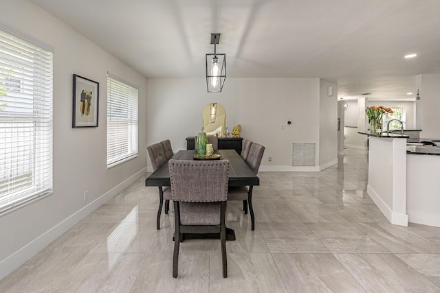 1518 Lee Ct, Lake Worth, FL 33461 - dining room featuring light marble finish flooring and baseboards