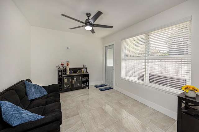 1518 Lee Ct, Lake Worth, FL 33461 - living room with a ceiling fan and light marble finish floors