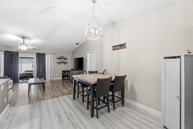 18 Winchmore Ln, Boynton Beach, FL 33426 - dining area with light wood-type flooring, vaulted ceiling, a chandelier, ceiling fan, and a textured ceiling
