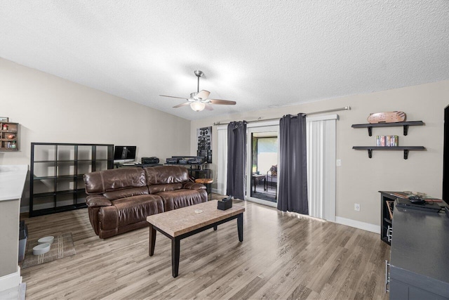 18 Winchmore Ln, Boynton Beach, FL 33426 - living area featuring light wood finished floors, ceiling fan, a textured ceiling, and vaulted ceiling