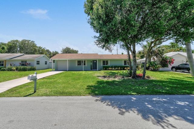 1522 Lance Rd, Jupiter, FL 33469 - ranch-style house with concrete driveway, a garage, and a front yard