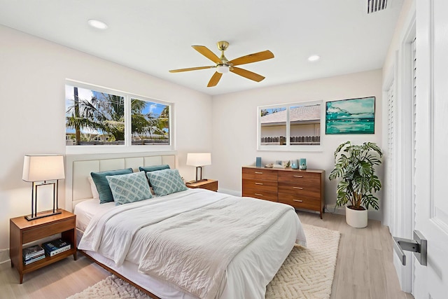 1522 Lance Rd, Jupiter, FL 33469 - bedroom with light wood finished floors, recessed lighting, and a ceiling fan