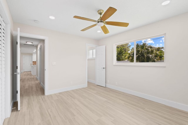 1522 Lance Rd, Jupiter, FL 33469 - unfurnished bedroom with light wood-style floors, recessed lighting, and a ceiling fan