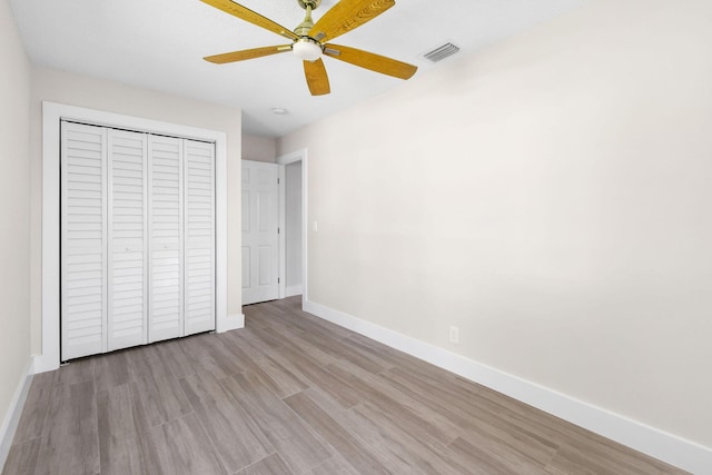 1522 Lance Rd, Jupiter, FL 33469 - unfurnished bedroom featuring wood finished floors, a closet, and a ceiling fan
