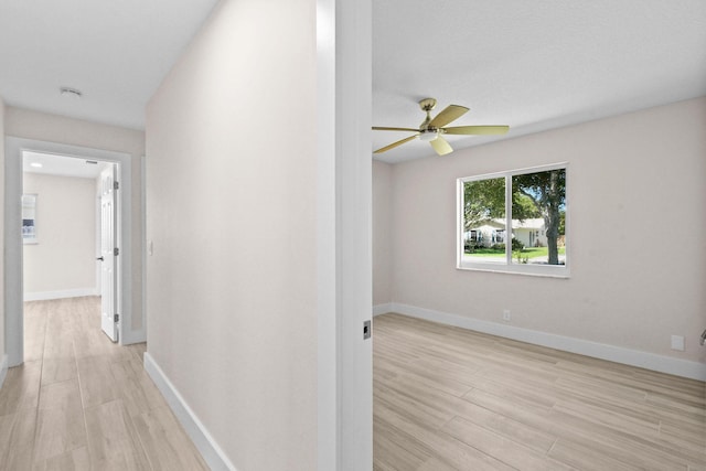 1522 Lance Rd, Jupiter, FL 33469 - hallway with light wood-type flooring and baseboards