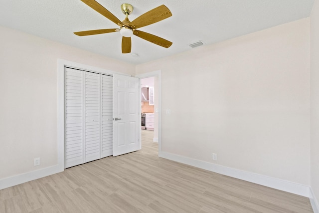 1522 Lance Rd, Jupiter, FL 33469 - unfurnished bedroom featuring light wood finished floors, a closet, and ceiling fan