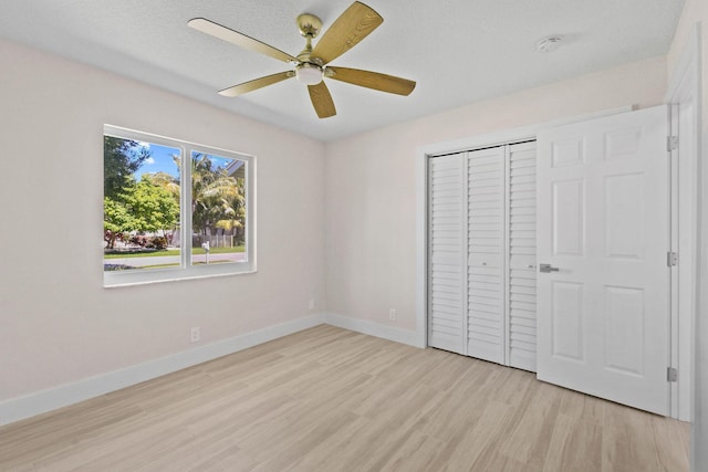 1522 Lance Rd, Jupiter, FL 33469 - unfurnished bedroom featuring light wood finished floors, a closet, and ceiling fan