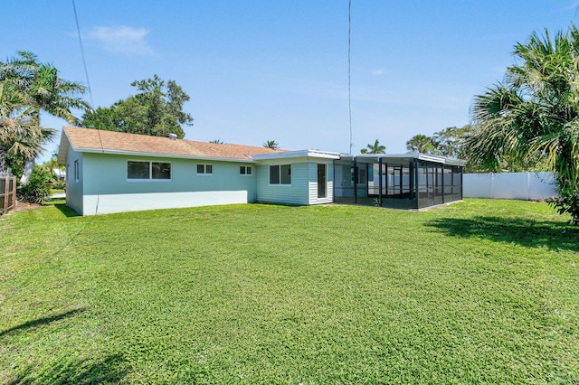 1522 Lance Rd, Jupiter, FL 33469 - rear view of property with a sunroom, stucco siding, and a fenced backyard