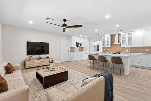 1522 Lance Rd, Jupiter, FL 33469 - living room with light wood-type flooring, ceiling fan, and recessed lighting
