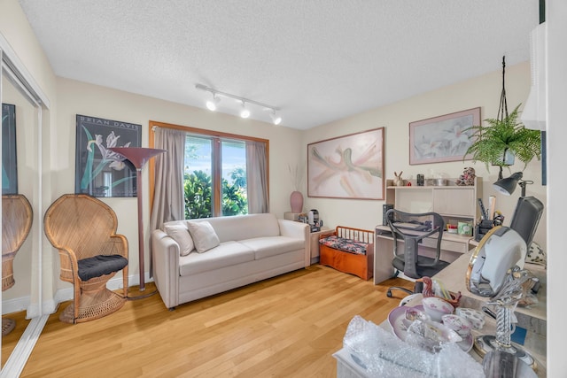 9070 NW 16th St, Plantation, FL 33322 - living area with light wood finished floors and a textured ceiling