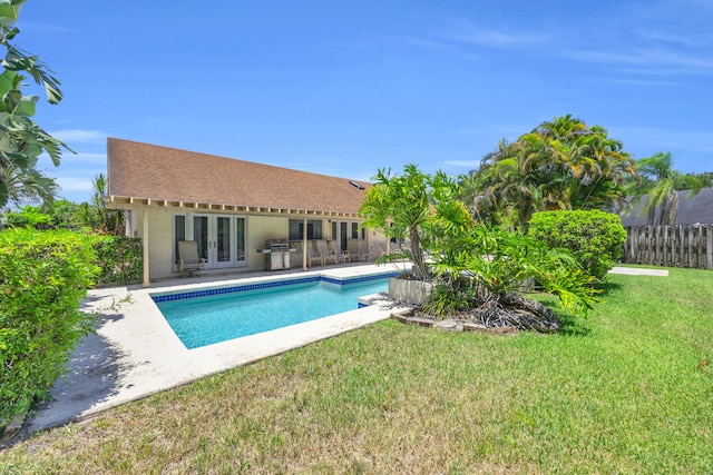 9070 NW 16th St, Plantation, FL 33322 - view of swimming pool featuring french doors, a patio, and a grill