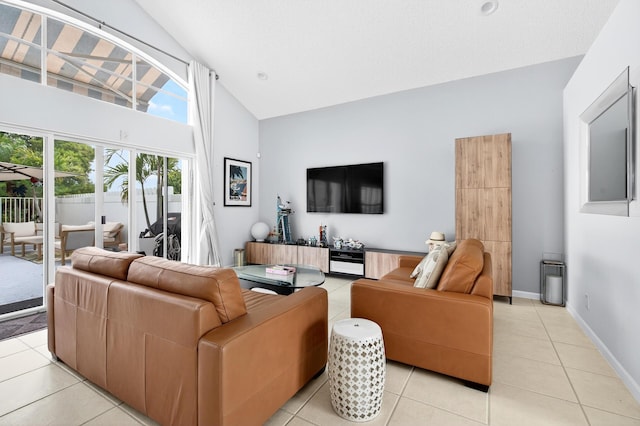 5086 Prairie Dunes Village Cir, Lake Worth, FL 33463 - living room featuring high vaulted ceiling and light tile patterned floors
