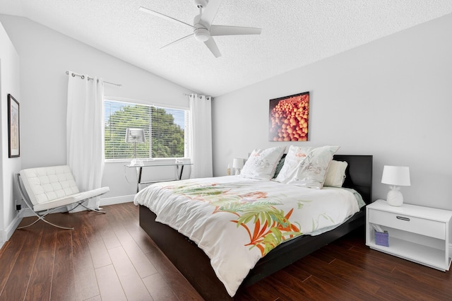 5086 Prairie Dunes Village Cir, Lake Worth, FL 33463 - bedroom featuring a textured ceiling, hardwood / wood-style flooring, vaulted ceiling, and a ceiling fan