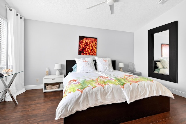 5086 Prairie Dunes Village Cir, Lake Worth, FL 33463 - bedroom with wood finished floors, a textured ceiling, lofted ceiling, and a ceiling fan