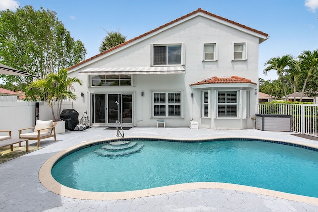 5086 Prairie Dunes Village Cir, Lake Worth, FL 33463 - back of property with stucco siding, a patio, and a tiled roof