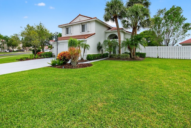 5086 Prairie Dunes Village Cir, Lake Worth, FL 33463 - mediterranean / spanish-style home with concrete driveway, a tiled roof, and stucco siding