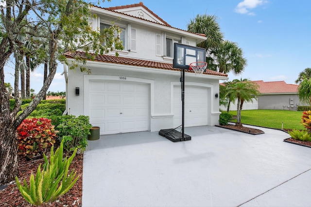 5086 Prairie Dunes Village Cir, Lake Worth, FL 33463 - mediterranean / spanish-style home featuring a tile roof, stucco siding, an attached garage, and concrete driveway