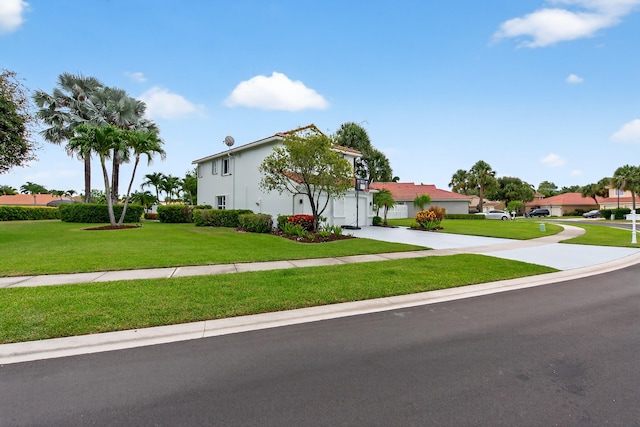 5086 Prairie Dunes Village Cir, Lake Worth, FL 33463 - view of front of home with a front lawn and driveway