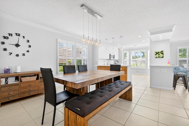 5086 Prairie Dunes Village Cir, Lake Worth, FL 33463 - dining space with crown molding, light tile patterned floors, healthy amount of natural light, a textured ceiling, and recessed lighting