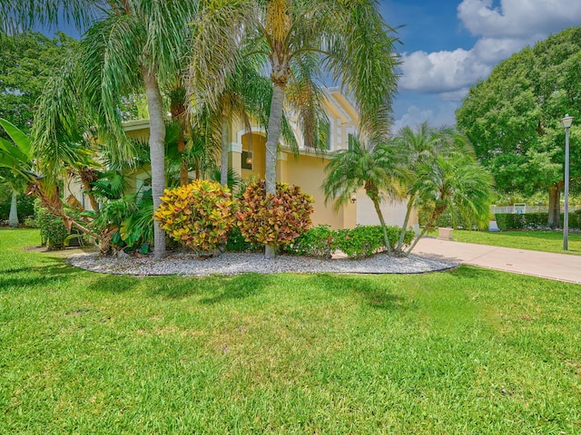10889 Fillmore Dr, Boynton Beach, FL 33437 - view of front of home featuring stucco siding and a front yard