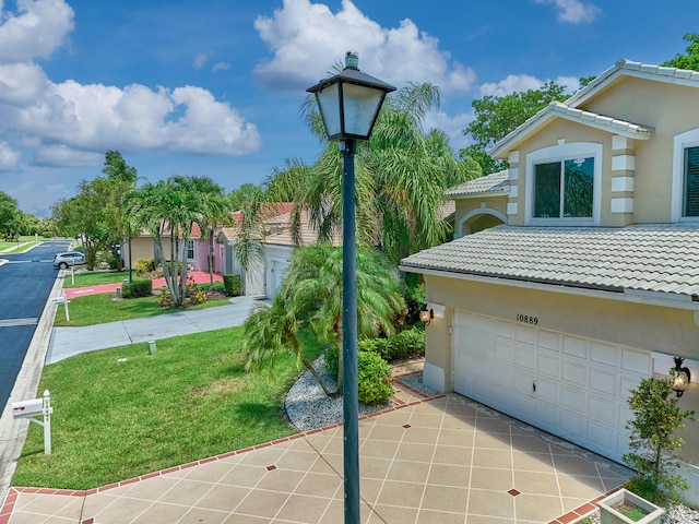 10889 Fillmore Dr, Boynton Beach, FL 33437 - exterior space featuring an attached garage and concrete driveway