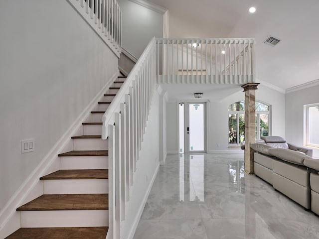 10889 Fillmore Dr, Boynton Beach, FL 33437 - staircase featuring marble tiled floors, ornamental molding, recessed lighting, ornate columns, and a towering ceiling