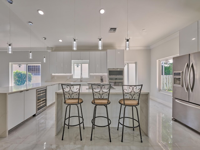 10889 Fillmore Dr, Boynton Beach, FL 33437 - kitchen featuring stainless steel appliances, beverage cooler, modern cabinets, white cabinets, and light marble finish flooring