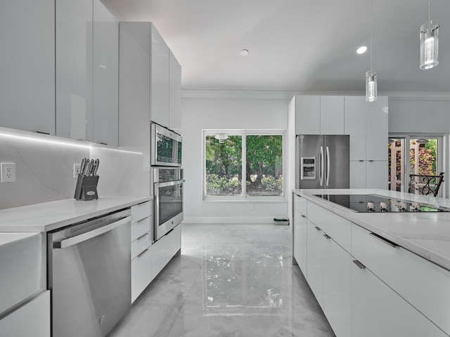10889 Fillmore Dr, Boynton Beach, FL 33437 - kitchen with appliances with stainless steel finishes, modern cabinets, light marble finish flooring, ornamental molding, and white cabinets