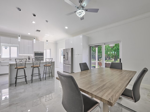 10889 Fillmore Dr, Boynton Beach, FL 33437 - dining room featuring light marble finish floors, crown molding, plenty of natural light, recessed lighting, and a ceiling fan