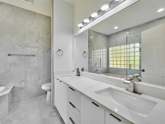 10889 Fillmore Dr, Boynton Beach, FL 33437 - bathroom with a tub with marble appearance, double vanity, and marble tiled floors