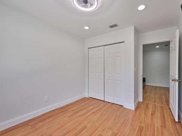10889 Fillmore Dr, Boynton Beach, FL 33437 - unfurnished bedroom with light wood-style flooring, recessed lighting, and a closet