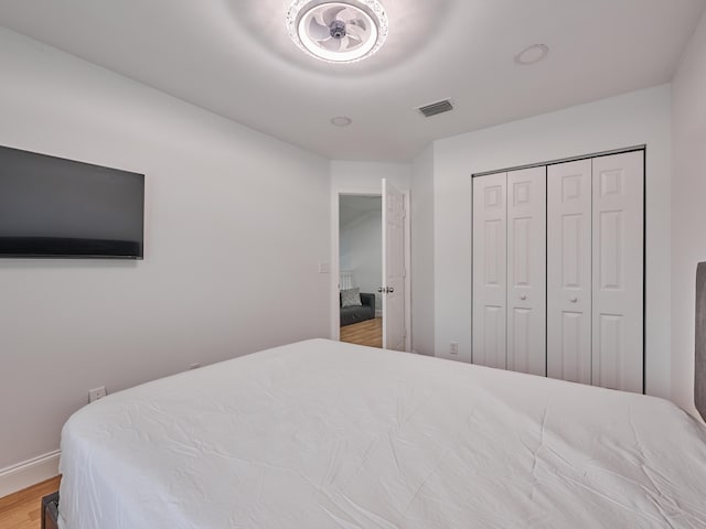 10889 Fillmore Dr, Boynton Beach, FL 33437 - bedroom featuring wood finished floors and a closet