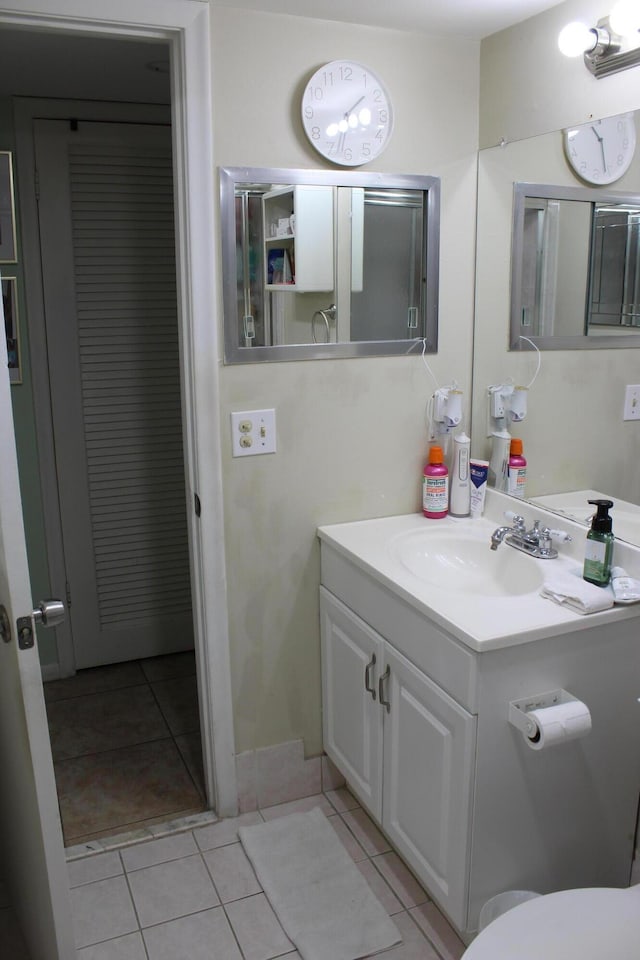 333 Northampton Unit Q, West Palm Beach, FL 33417 - bathroom featuring tile patterned flooring and vanity