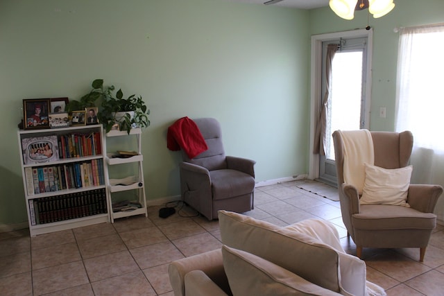 333 Northampton Unit Q, West Palm Beach, FL 33417 - tiled living room featuring baseboards