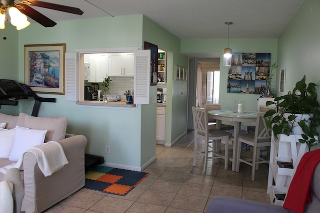 333 Northampton Unit Q, West Palm Beach, FL 33417 - living area with ceiling fan and light tile patterned floors