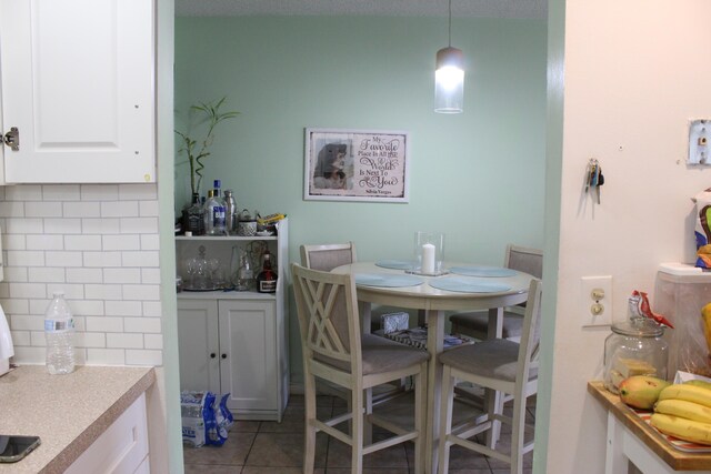333 Northampton Unit Q, West Palm Beach, FL 33417 - dining space featuring light tile patterned floors