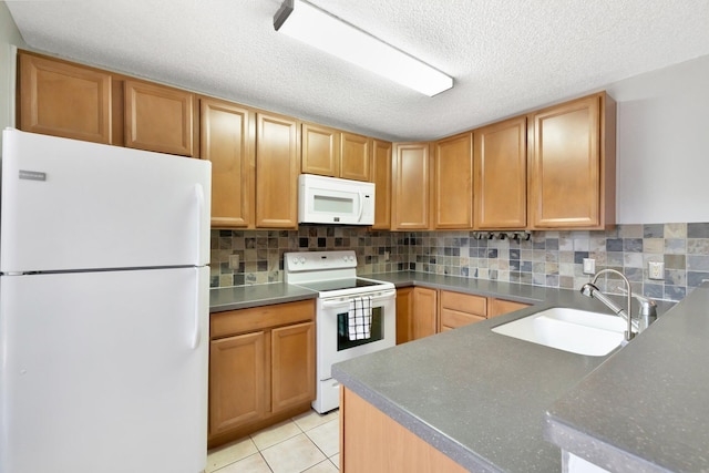 3675 SW Sunset Trace Cir, Palm City, FL 34990 - kitchen with white appliances, decorative backsplash, a textured ceiling, and light tile patterned floors