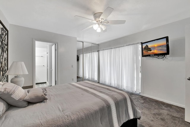 3675 SW Sunset Trace Cir, Palm City, FL 34990 - bedroom with carpet, a ceiling fan, and ensuite bath