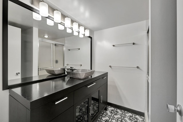 3675 SW Sunset Trace Cir, Palm City, FL 34990 - bathroom with an enclosed shower, vanity, and tile patterned floors