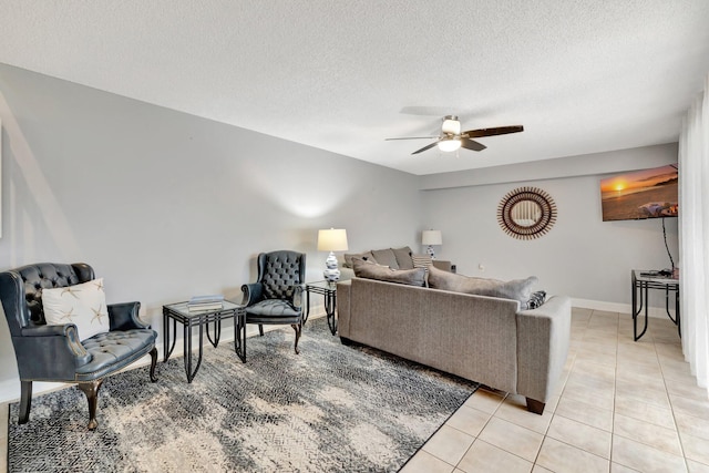 3675 SW Sunset Trace Cir, Palm City, FL 34990 - living room featuring a ceiling fan, a textured ceiling, and light tile patterned floors