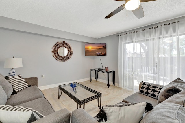 3675 SW Sunset Trace Cir, Palm City, FL 34990 - living area featuring ceiling fan, a textured ceiling, and light tile patterned flooring