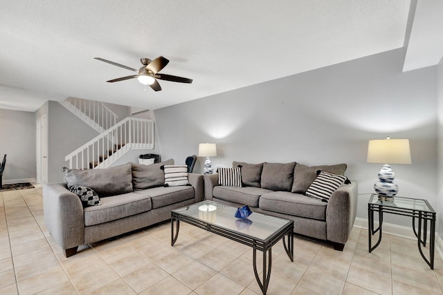 3675 SW Sunset Trace Cir, Palm City, FL 34990 - living area featuring stairway, light tile patterned floors, and a ceiling fan