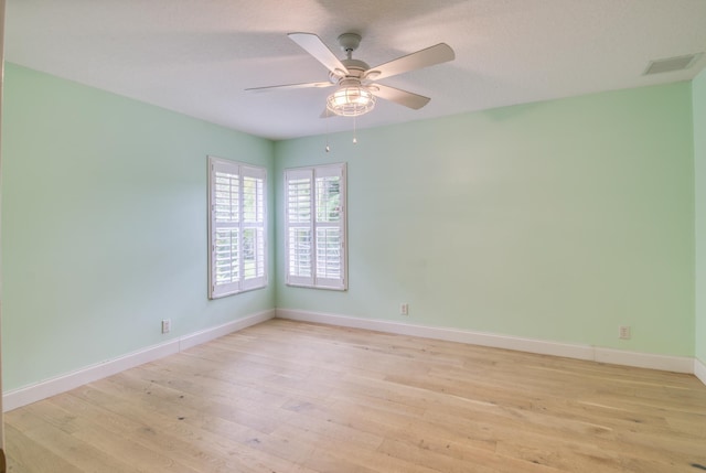 15213 N 93rd St, The Acreage, FL 33412 - empty room with light wood-style flooring and a ceiling fan