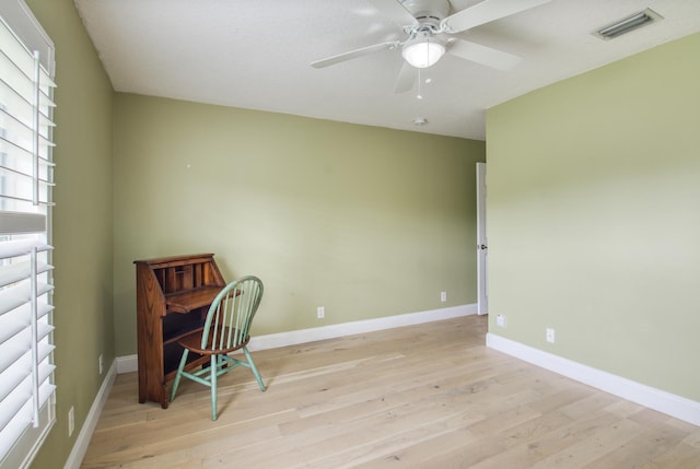 15213 N 93rd St, The Acreage, FL 33412 - unfurnished office with light wood-style flooring and a ceiling fan