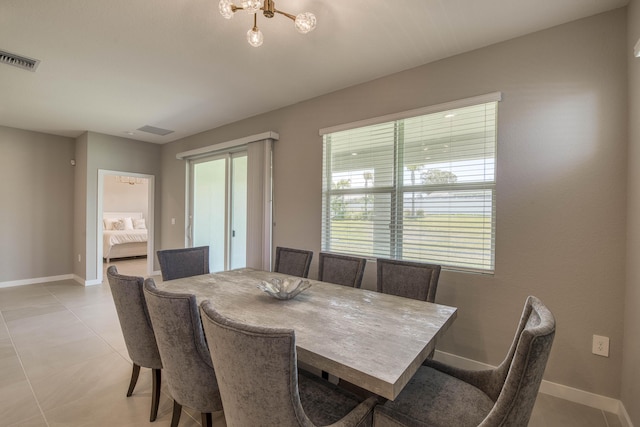 1878 NE Ocean Dunes Dr, Jensen Beach, FL 34957 - dining room featuring a chandelier and light tile patterned flooring