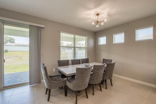 1878 NE Ocean Dunes Dr, Jensen Beach, FL 34957 - dining space featuring a chandelier and light tile patterned floors